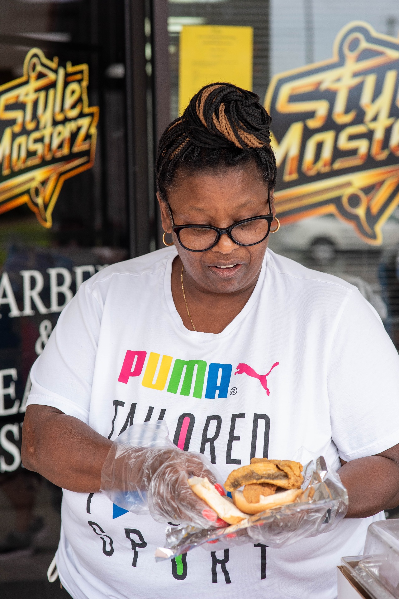 Volunteer handing out fresh food plates during the event