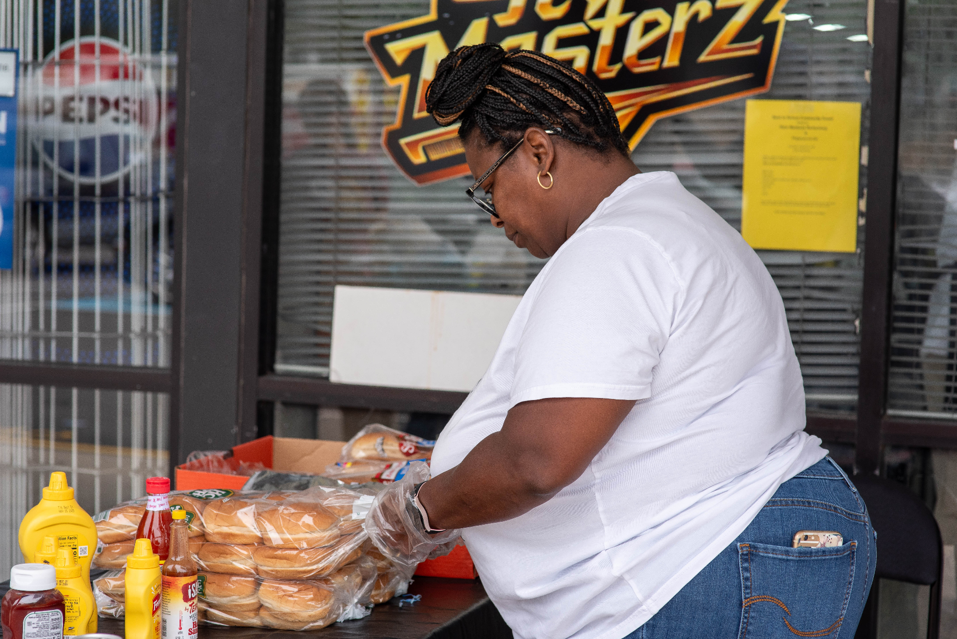 Preparing buns and condiments for the cookout line