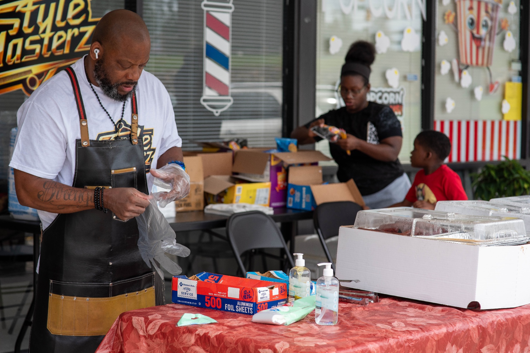 Volunteers prepping food and snacks for guests
