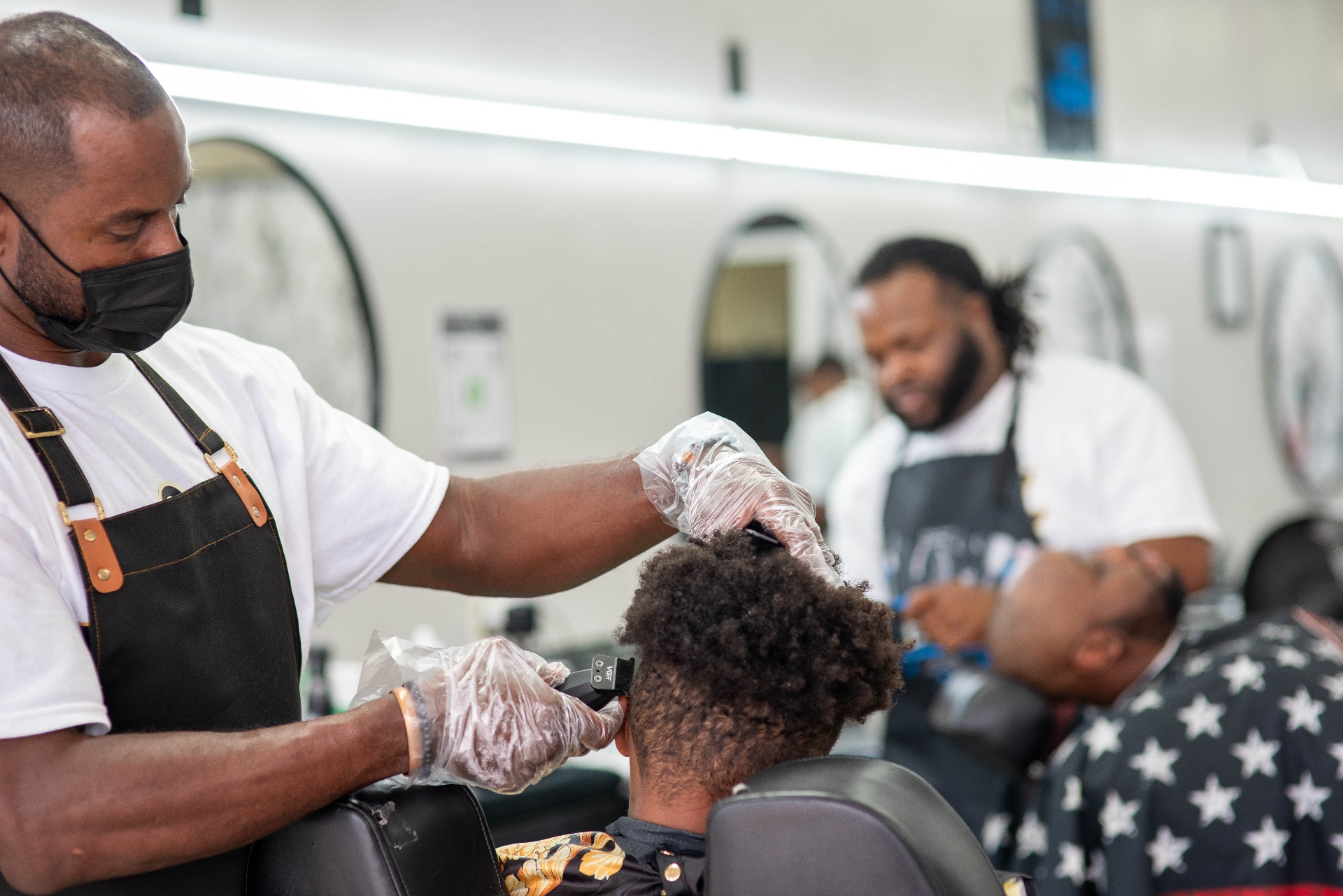 Detailed clipper work on a precision haircut